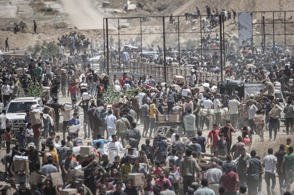 Palestinians gather at a new Gaza Humanitarian Foundation distribution centre in central Gaza on Thursday.