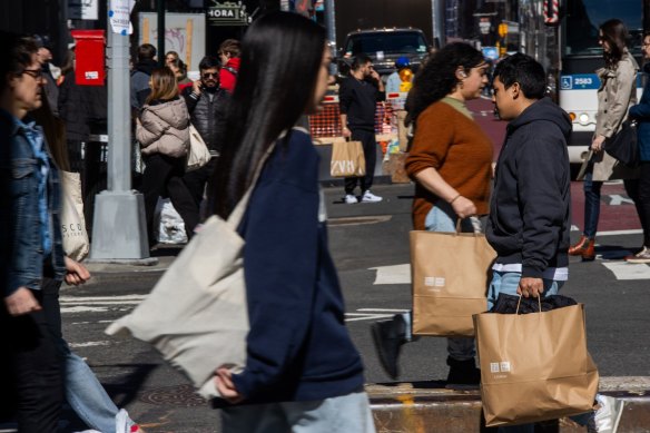 Shoppers in SoHo, New York, last week. The US economy is doing well despite higher interest rates.