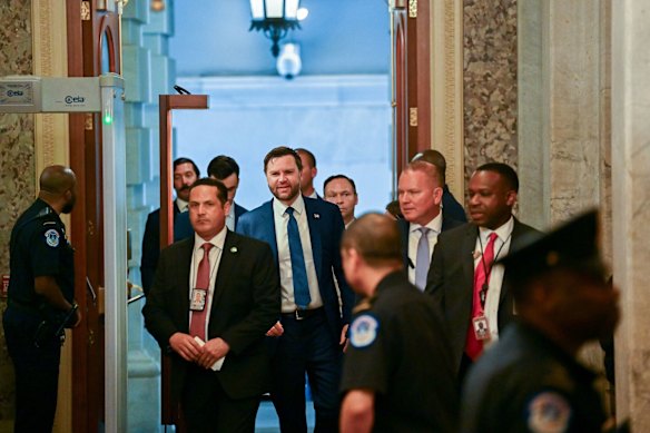 US Vice President J.D. Vance, centre, arrives at the US Capitol in Washington ahead of the vote.