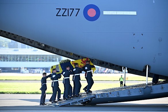 Pallbearers from the Queen’s Colour Squadron of the Royal Air Force (RAF) carry the coffin of Queen Elizabeth II, into an RAF C17 plan at Edinburgh airport in 2022.