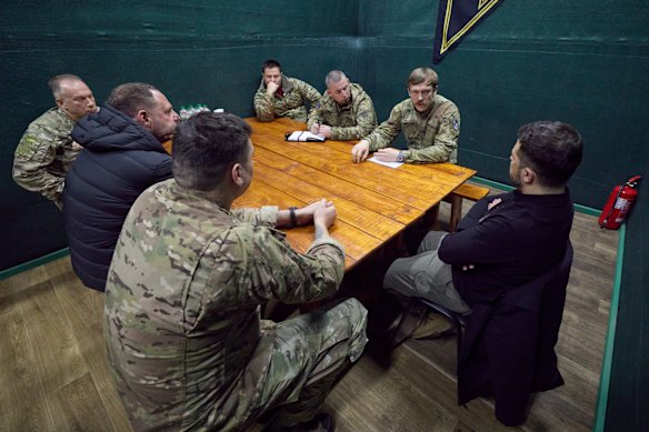 Ukrainian President Volodymyr Zelensky, right, met with servicemen near Pokrovsk last week.