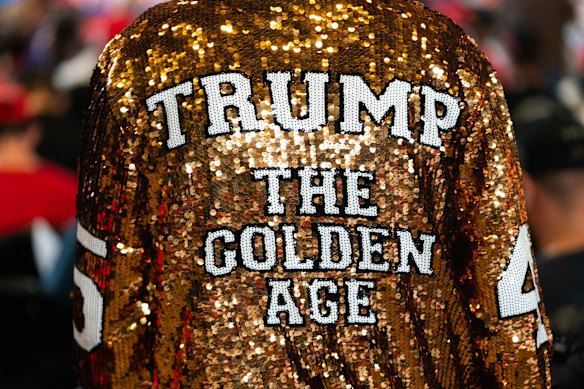 Most supporters wear MAGA regalia, including sparkly gold jerseys.