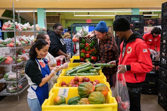 Volunteers sort donated food items at a food bank in New York. 