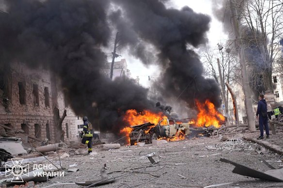 Firefighters put out the fire following Russia’s missile attack in Sumy, Ukraine.