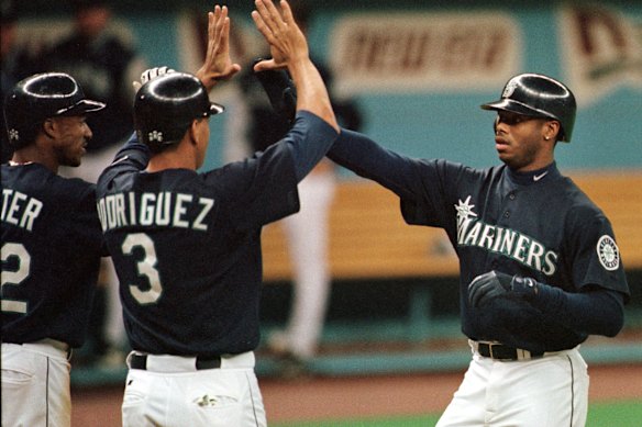 Ken Griffey Jr. (right), in his playing days for Seattle.