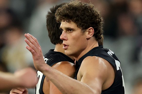 Charlie Curnow of the Blues is congratulated by Ashton Moir after kicking a goal.