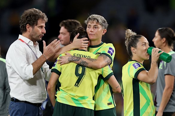 Joe Montemurro and Michelle Heyman console Caitlin Foord after full-time.