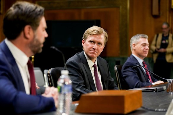 US undersecretary of defence Elbridge Colby (centre) is leading a review of the AUKUS submarine deal.