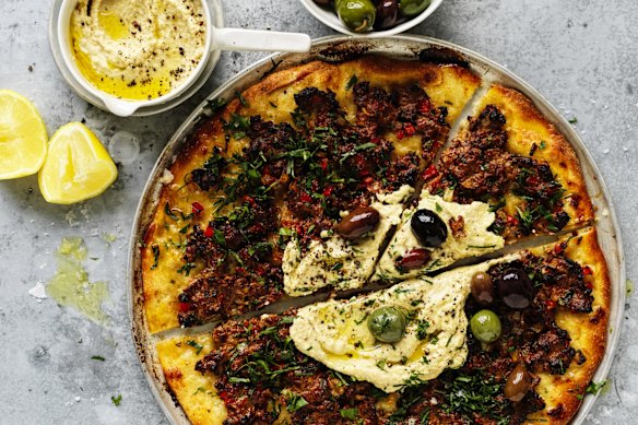 Lahmacun with hummus and olives.