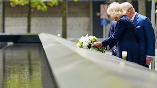 Queen Camilla lays flowers at the 9/11 memorial.