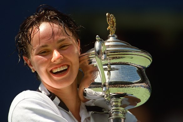 Martina Hingis with one of her three Australian Open singles trophies.