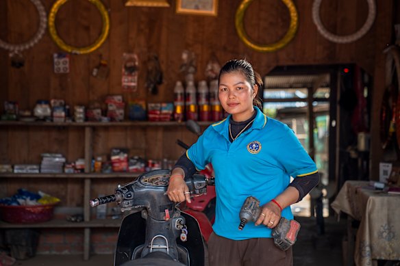 Kanada, 26, is the first woman in her village to open her own mechanic shop.