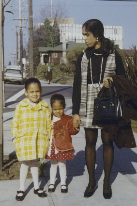 This January 1970 photo shows Kamala, left, with her sister, Maya, and mother, Shyamala, outside their apartment in Berkeley, California, after her parents’ separation. 