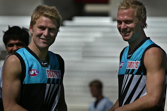 Kane and Chad Cornes in their time as Power teammates in 2003.