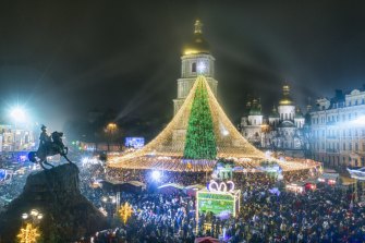 Crowds of people celebrate the New Year in Kyiv, Ukraine, on Jan. 1, 2021.