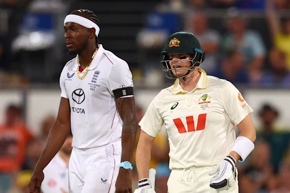 Steve Smith, wearing eye-black, confronts Jofra Archer in a spirited end to the Brisbane Test earlier this month.