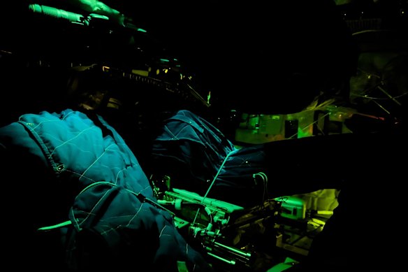 Artemis II crewmember sleeping bags are illuminated inside the Orion spacecraft.