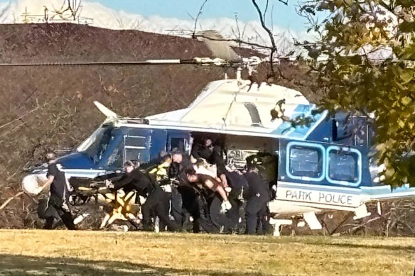 A U.S. Capitol Park Police helicopter is seen on Washington’s National Mall evacuating a National Guard shooting victim on Wednesday.