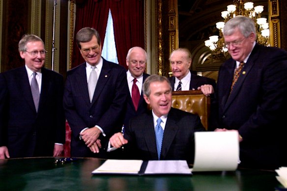 Mitch McConnell (left) and Dick Cheney (third from left) as George W. Bush signs proclamations following his inauguration in 2001.