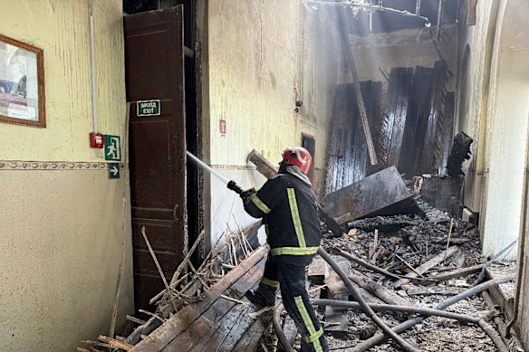 Firefighters put out the fire in a school following a Russian air attack in Kropyvnytskyi, Ukraine.