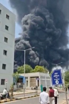 Smoke rises after the plane crash in Ahmedabad, India.
