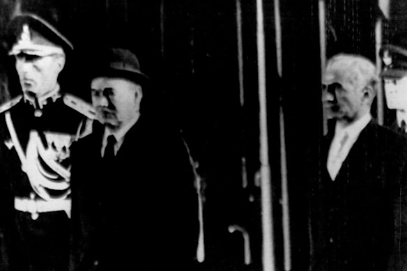 Governor-general Sir Paul Hasluck (left) walks with the Shah of Iran to inspect the guard of honour on his arrival for the anniversary celebrations in October 1971.