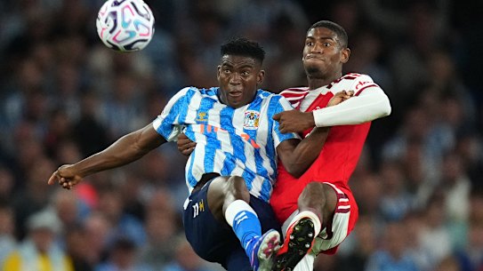 Coventry City’s Taiwo Awoniyi fights for the ball with Arsenal’s Cristhian Mosquera.