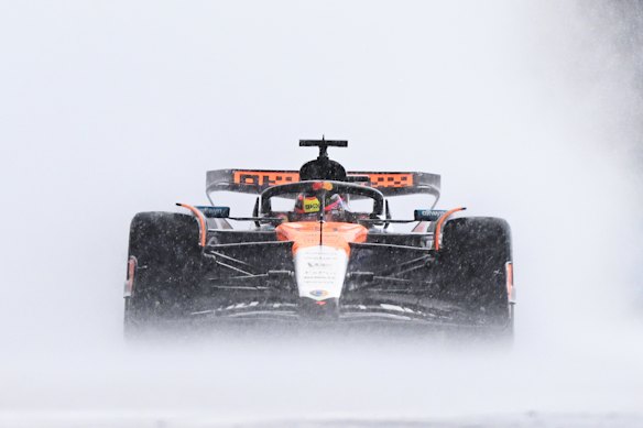 Oscar Piastri negotiates wet conditions at Silverstone.
