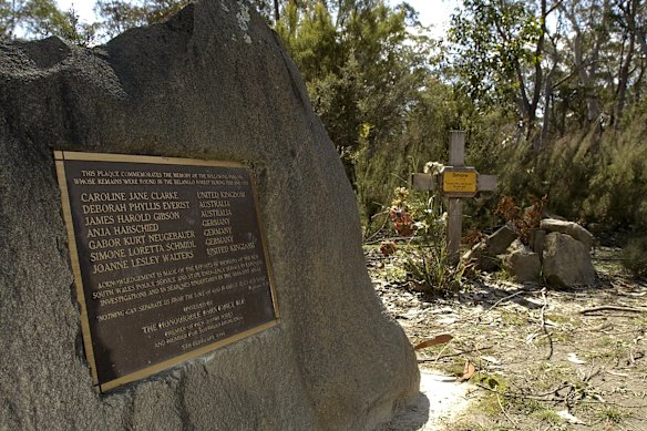 A memorial at Belanglo State Forest; the larger rock bearing a plaque with the names of the backpacker victims, and a tribute to the search workers who combed the site.