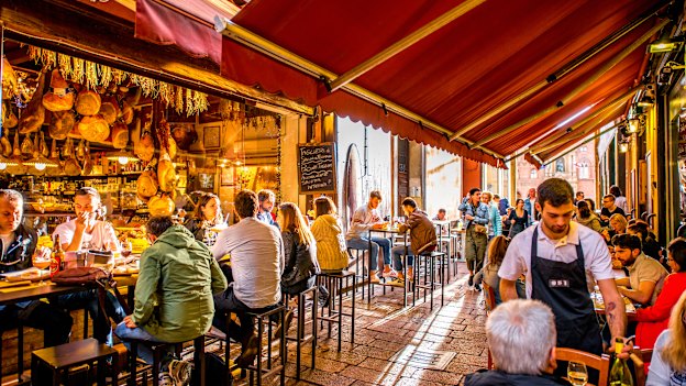Lunchtime on Bologna’s Pescherie Vecchie street, not far from the  famous food markets and shops in the centre of the old town. 
