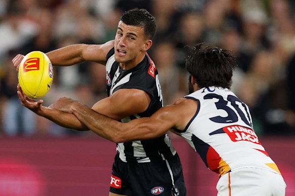Wayne Milera pays close attention to Nick Daicos.