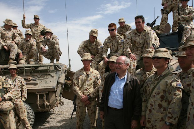 John Howard visiting Australian soldiers in Afghanistan in 2007. Australia’s military presence would remain until 2021.
