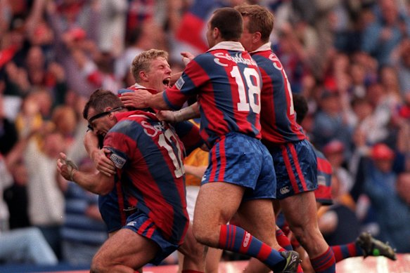  Darren Albert and the Knights celebrate an improbable grand final victory in 1997.