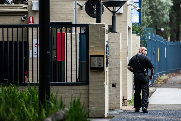 A guard outside a Jewish school in Sydney in January last year.