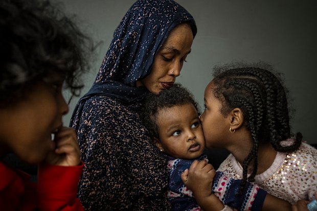 Atherton Gardens public housing resident, Ragto Muse with her children Amara, 1, Ayah, 4, and Ali in their unit, Fitzroy.