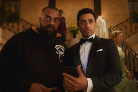 Riz Ahmed (right) plays obscure actor Shah Latif, who flubs a screen test to become the new James Bond – but then the internet loses its mind over a Muslim 007.