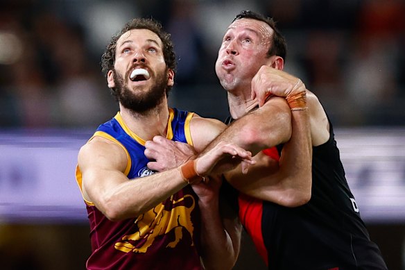 Todd Goldstein wrestles Brisbane’s Darcy Fort in a ruck duel.