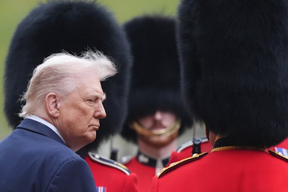 Donald Trump reviews the guard of honour during his ceremonial welcome in Windsor, England, on Wednesday.