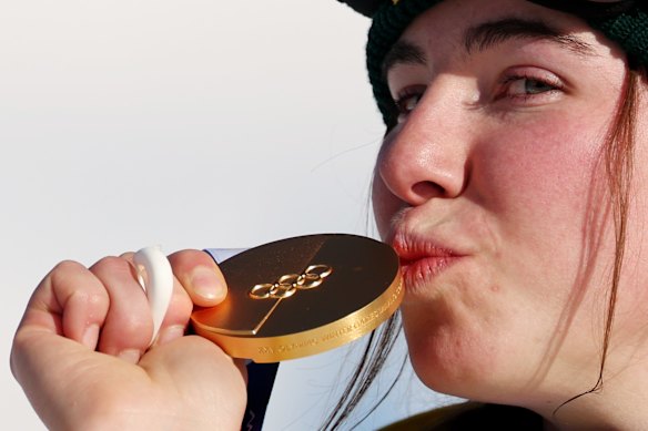 Josie Baff kisses her gold medal.