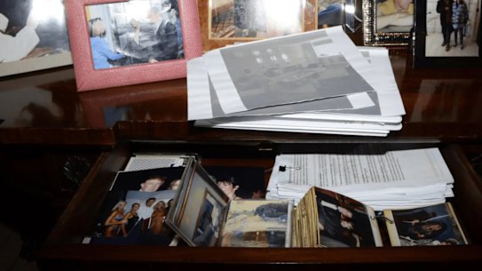 A photo taken of a cabinet in Jeffrey Epstein’s New York home, containing at least one image of US President Donald Trump.