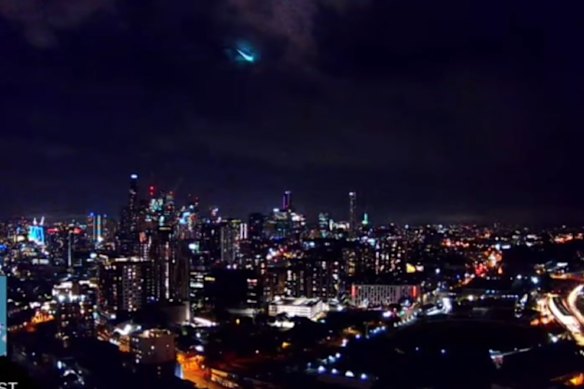The bright flash of a meteor falling to earth above the Brisbane city skyline on the evening of April 21, 2025.