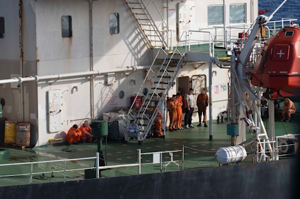 Crew members on the vessel.