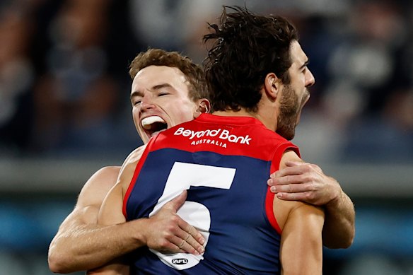 Jack Henderson (left) and Christian Petracca of the Demons celebrate.