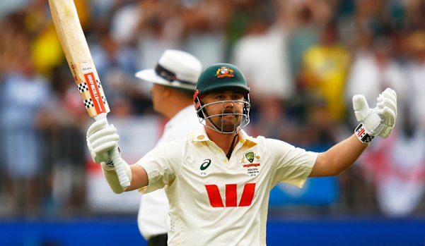 Travis Head celebrates his century on day two of the first Ashes Test in Perth.