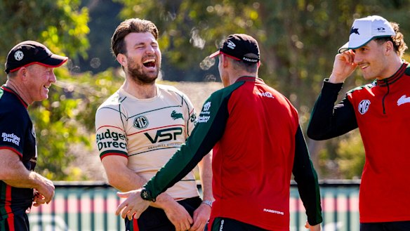 Jai Arrow has a laugh with teammates and South Sydney staff before his 100th game for the Rabbitohs.