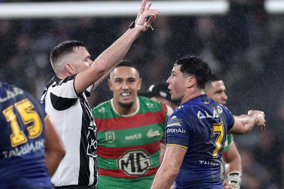 Referee Liam Kennedy sends Mitchell Moses to the sin bin.