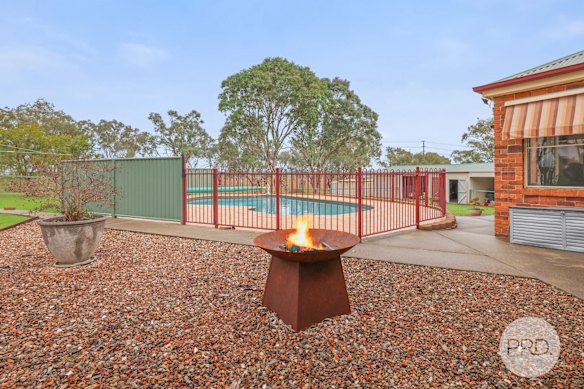 The home in country NSW has a backyard pool and parking for six cars.