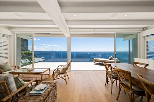 The five-bedroom, four-bathroom abode occupies three levels and has a neutral palette with oak floors, plantation shutters and bi-fold doors.