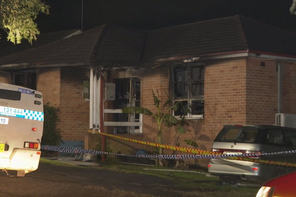A silver people-mover van, the type favoured by large families, sat in the driveway behind police tape at the home.