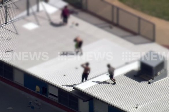 Youths on the roof of Banksia Hill on Monday afternoon.
